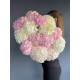 A bouquet of pink, blue and white hydrangeas