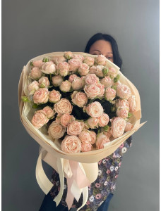 A bouquet of Bombastic spray roses in a package.