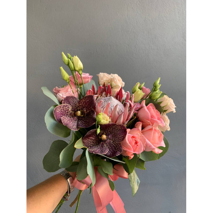 A wedding bouquet of royal protea, chocolate orchid Vanda, delicate roses, eustoma, and eucalyptus (No. 19122)