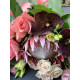 A wedding bouquet of royal protea, chocolate orchid Vanda, delicate roses, eustoma, and eucalyptus (No. 19122)