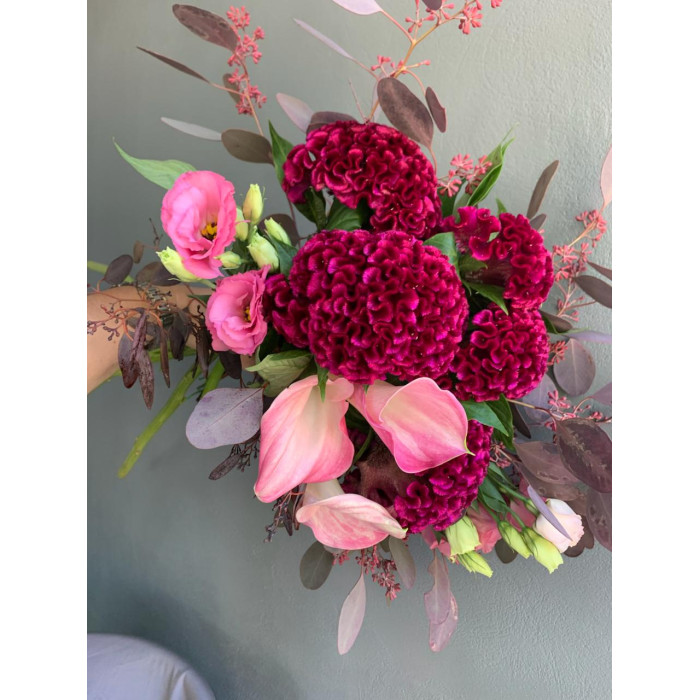 A bridal bouquet of seasonal burgundy celosia, dyed to match, eucalyptus, zantedexia, and eustoma (No. 19118)